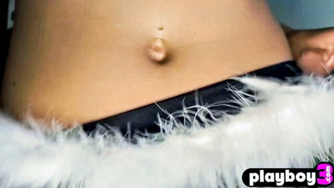 Athletic babe's sexy outie belly button teasing above feathered black panties