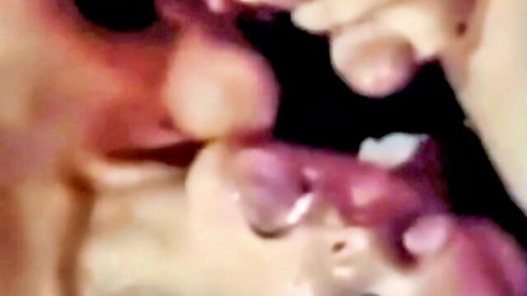 Blonde woman sucking thick cock with pink lips wrapped around shaft in closeup blowjob