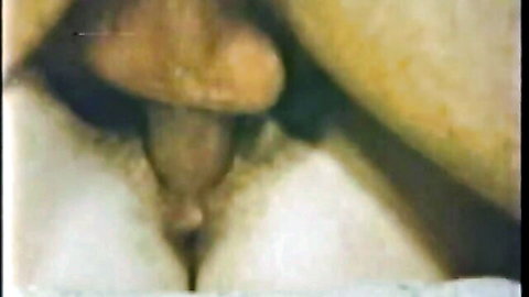 Vintage close-up of Sweet Sue's exposed pussy with insertion in retro porn