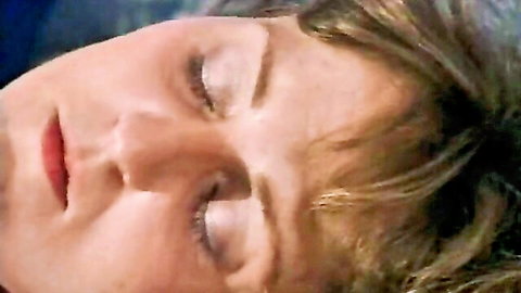 Vintage blonde woman eyes closed serene face close-up from 1990 classic XXX