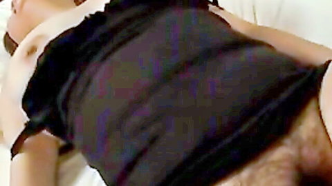 Mature Japanese woman with hairy pussy spreads legs exposing bushy crotch and tits POV