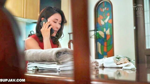 Yuka Mizuno in red dress on phone, mature Japanese MILF in kitchen