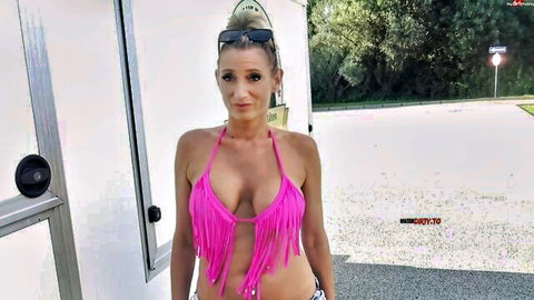 Vika Viktoria in fringed pink bikini top and shorts outdoors