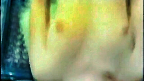 Close-up of erect nipple on pale woman's bare tit in vintage scene