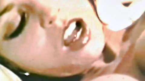 Vintage blonde bombshell with open mouth and ecstatic face during blowjob closeup