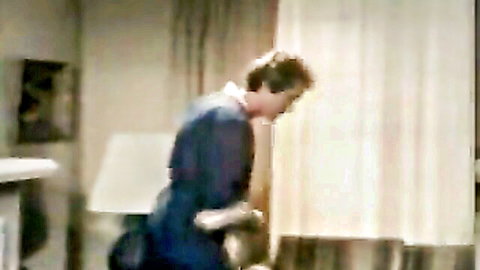Vintage 1984 porn thumbnail: woman in blue dress leaning forward intimately