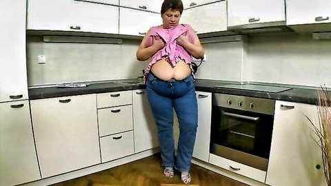 Mature white BBW housewife teasing in open purple blouse and jeans
