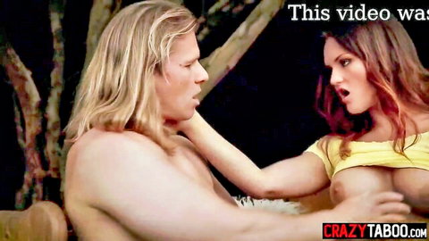 Big tits redhead MILF grabs blonde stud's cock outdoors in steamy scene