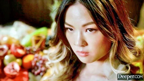 Mona Azar intense gaze in sensual fruit display from Deeper reverse gangbang