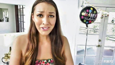 Brunette babe with medium natural tits in floral bandeau top gives aroused O-face birthday tease