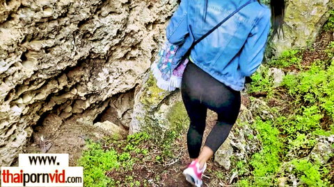 Joon Mali Thai MILF in tight leggings and denim jacket entering cave