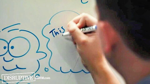 Man's hand drawing cartoon face and writing 'This' on whiteboard from behind