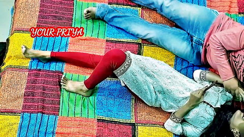 Your Priya Partner in amateur couple scene on colorful blanket, casual Indian attire