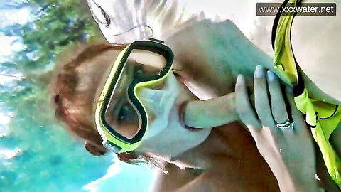Blonde woman in dive mask gives underwater blowjob to boyfriend