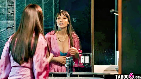 Curvy Latina Lexi Luna in pink silky robe showing cleavage in mirror