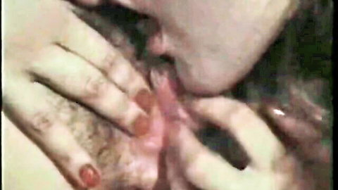 Vintage German blowjob close-up with woman's hand on bearded man's cock
