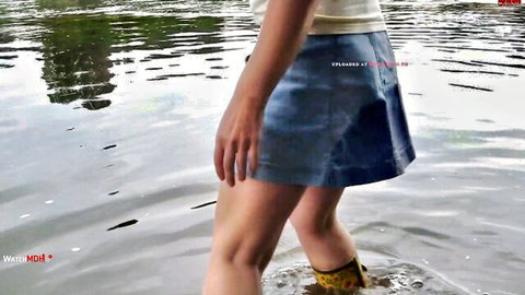 AnneDD28 exposing ass in short blue mini skirt wading in water