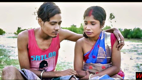 Desi village teen couple in saree and tank top intimate outdoor embrace