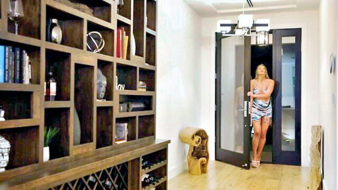 Kenzie Anne in zebra print mini dress, seductive doorway pose