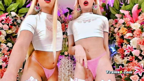 Two sexy blonde trans girls in pink thongs tease pussies with fingers open mouth pose