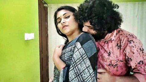 Indian man passionately hugs busty saree woman from behind groping her tits romantically