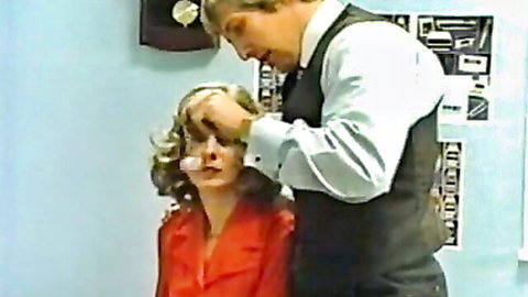 Vintage blonde woman hypnotized by suited man in classic Color Climax hardcore scene