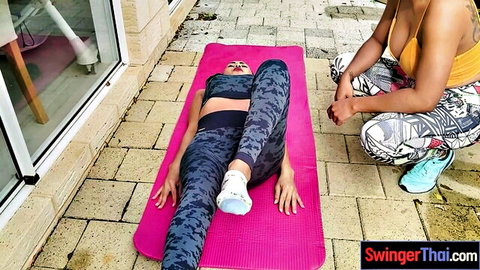 Joon Mali curvy Thai MILF stretching outdoors with friend in yoga pants