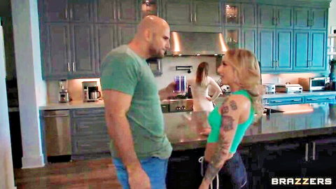 Tattooed blonde babe gropes bald stud's cock bulge in kitchen with hot friend nearby