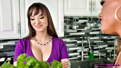 Lexi Luna and Aila Donovan in kitchen with deep cleavage tease