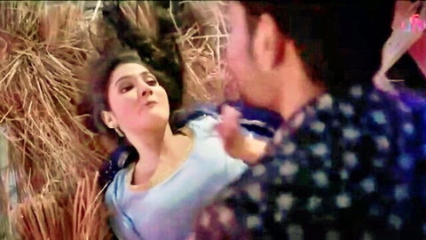 Desi village girl in blue top lying on hay with lover, intimate moment