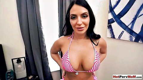 Curvy brunette MILF teases with massive tits spilling from pink striped bikini