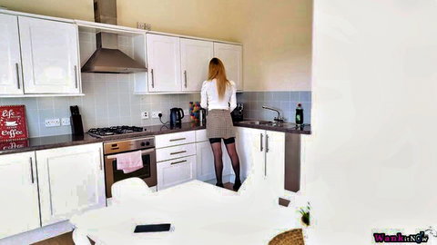 Lucy Alexandra in miniskirt, stockings, teasing in kitchen solo