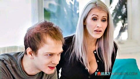 Surprised blonde stepmom with big tits and stepson focused on video game
