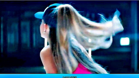 Blonde ponytail babe in pink top and cap with flowing hair turning seductively
