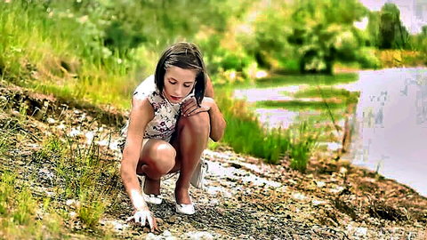 Young brunette teen in short floral dress kneeling outdoors by lake teasing curvy thighs and ass