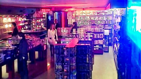 Laure Sainclair and Anita Blonde in seductive white dresses in video store
