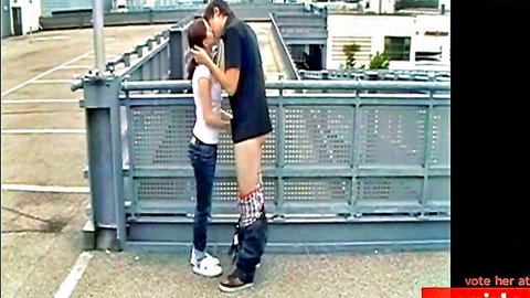 Petite redhead teen kissed by tall guy with exposed cock in parking garage