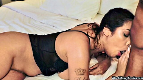 Curvy ebony babe with big ass and tits gives blowjob to thick black cock on bed