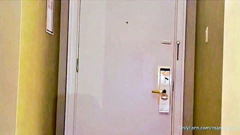 White apartment door in empty hallway with OnlyFans.com/manu watermark