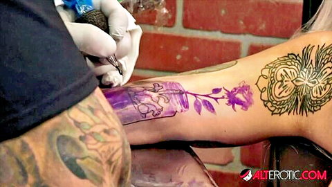 Amber Luke getting inked with rose jar tattoo on arm