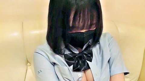 Busty Asian woman in unbuttoned blouse showing cleavage, black hair and mask