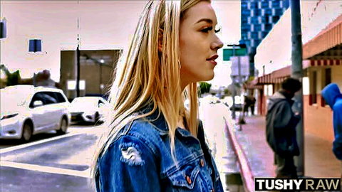 Anny Aurora blonde in ripped denim jacket on urban street, Tushy Raw preview