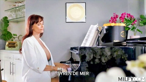 Syrren de Mer seductively playing piano in open white blazer, MILFY thumbnail
