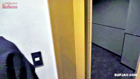 Blurry indoor JAV scene with open door and hanging jacket, uncensored personal shoot