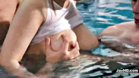 Mature Japanese star Suzuna Komiya in wet see-through shirt, squeezing breasts in pool