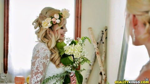 Lexi Lore as beautiful blonde bride in lace wedding dress holding bouquet
