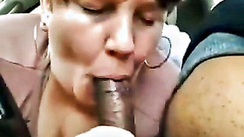 Mature chubby redhead nympho slurping thick BBC cock in car blowjob