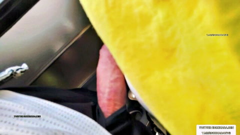 Erect pink cock pulled out from black pants on yellow car seat interior