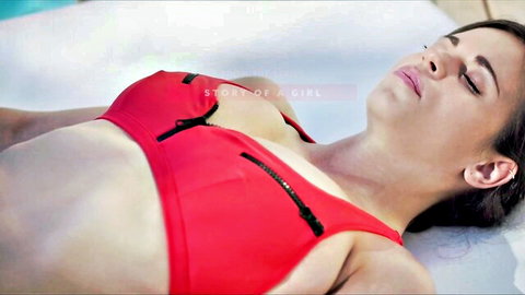 Nekane Sweet lounging in red zippered bikini top by pool