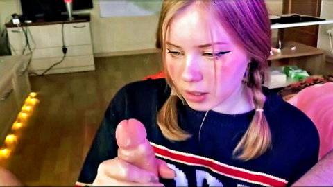 Cute blonde teen in pigtails giving messy blowjob on toy while smiling innocently